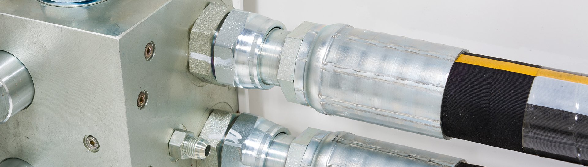 This is an image of hose fittings connected to a machine